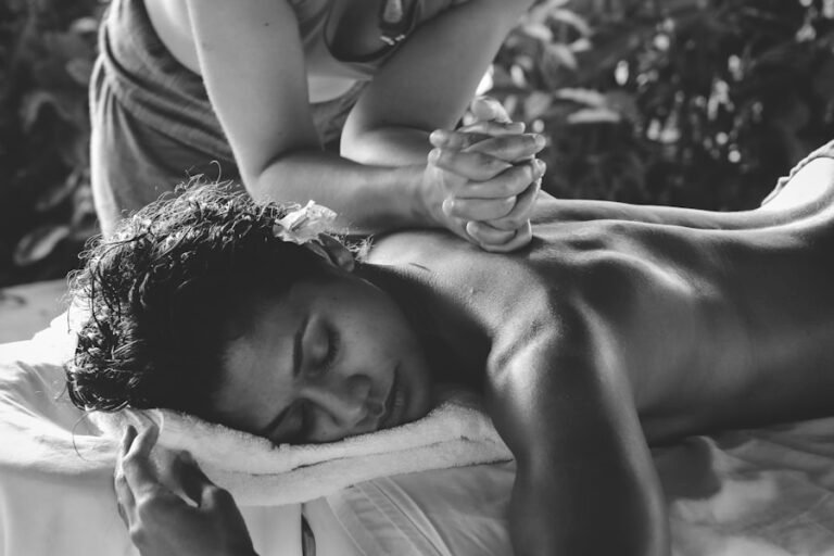 Deep tissue back massage focusing on shoulder tension