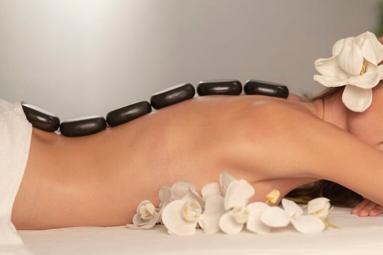 Hot stone massage with warmed basalt stones on the back